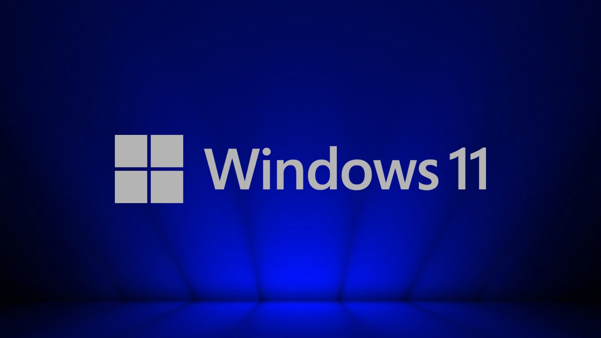 Windows 11 logo do sistema em destaque com fundo azul escuro