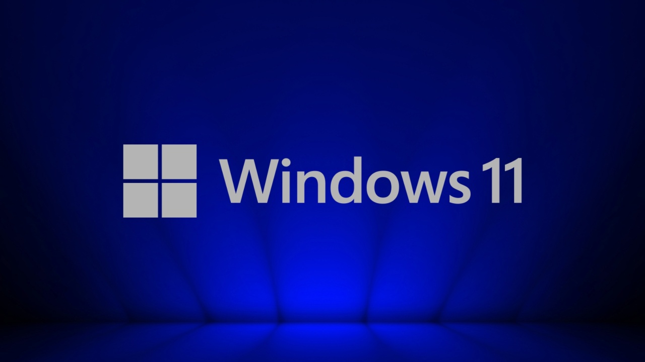Windows 11 logo do sistema em destaque com fundo azul escuro