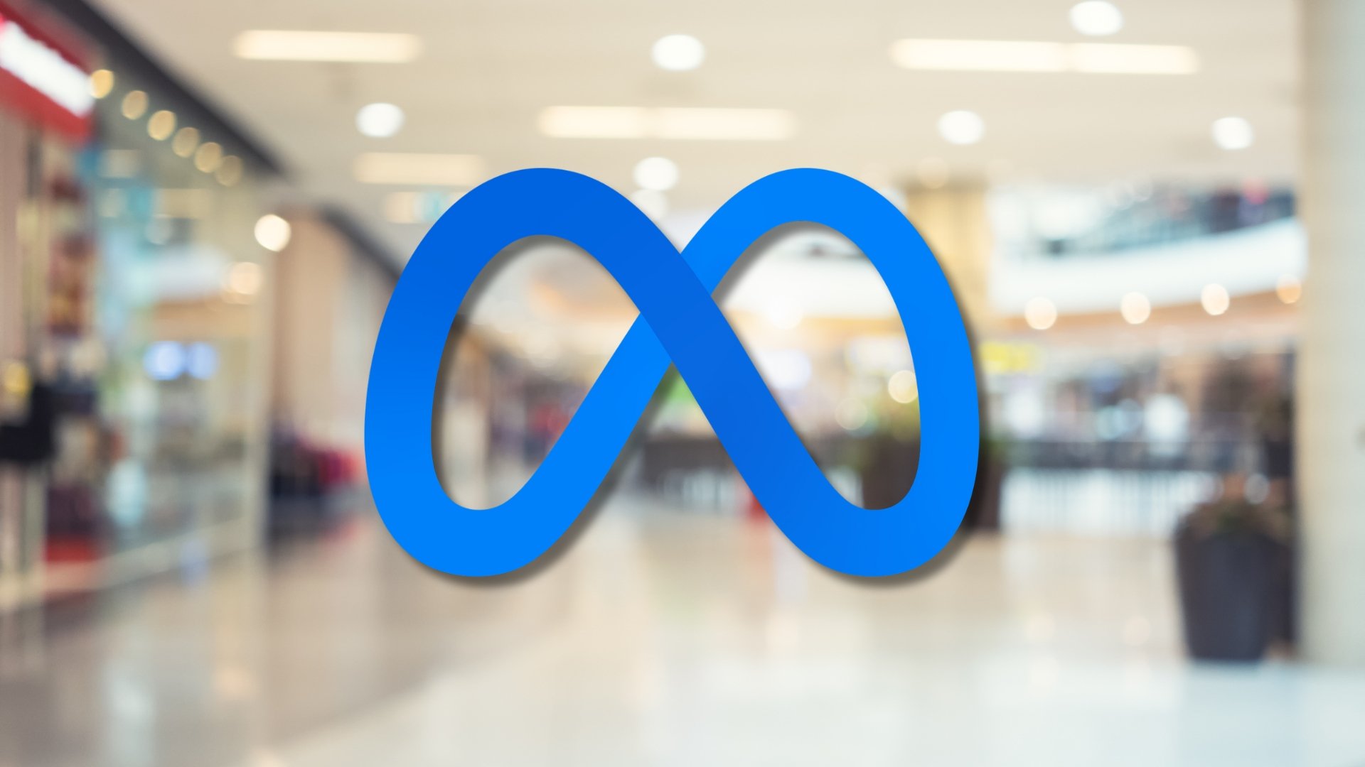Logo da Meta com fundo de lojas em centro comercial