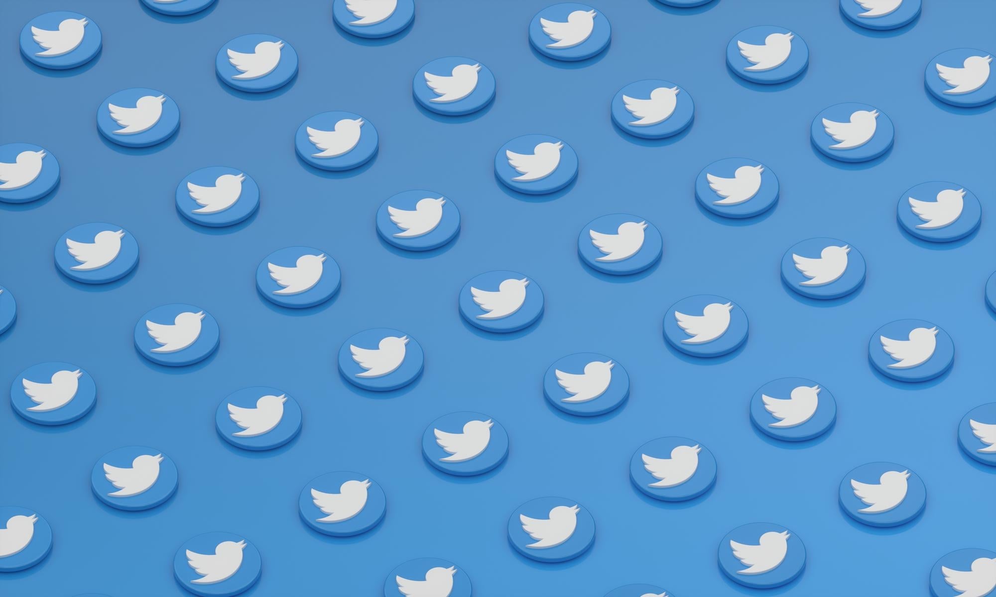 Logo do Twitter em padrão de fundo
