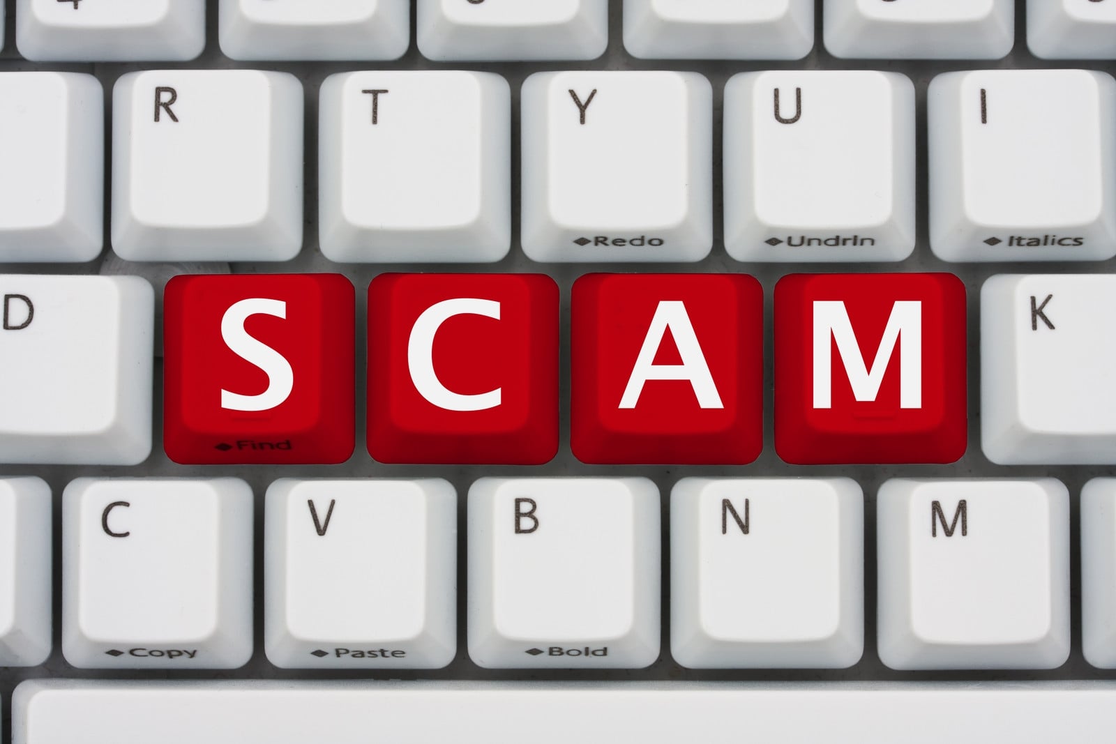teclado com a palavra scam