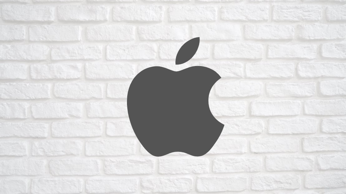 Apple logo sobre uma parede